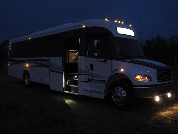 executive freightliner bus with restroom, night